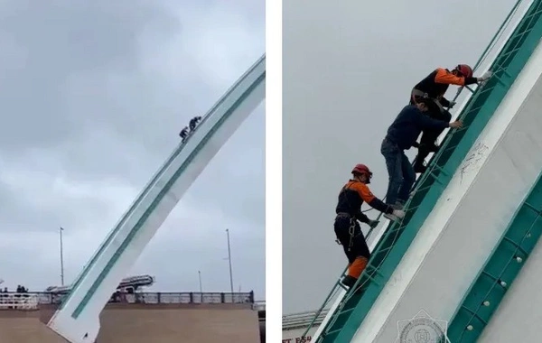 A Man Climbed Onto the Arch of the Karaotkel Bridge in Astana